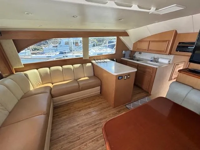 Slide: The Image of Luxurious interior of 2007 Jersey Cape 44 CNV yacht with leather seating and modern kitchen. - 3