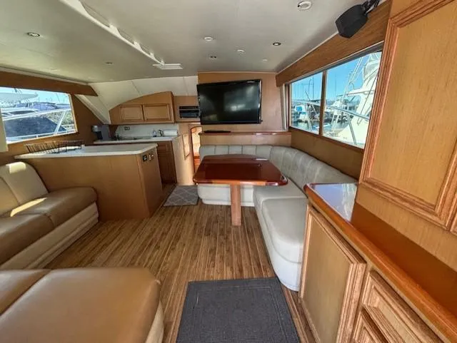 Slide: The Image of Luxurious interior of 2007 Jersey Cape 44 CNV yacht with wood finishes and modern amenities. - 33