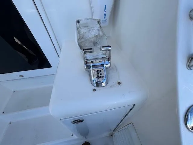 Slide: The Image of Control panel on 2007 Jersey Cape 44 CNV boat deck, featuring a keypad and protective cover. - 35