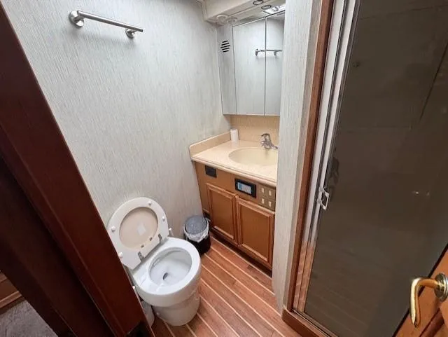 Slide: The Image of 2007 Jersey Cape 44 CNV yacht bathroom with toilet, sink, and shower. - 36