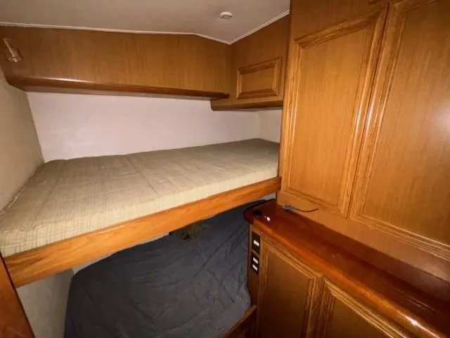 Slide: The Image of 2007 Jersey Cape 44 CNV cabin with wooden interior and bunk beds. - 39