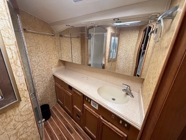 Slide: The Image of Luxurious bathroom in 2007 Jersey Cape 44 CNV yacht with elegant wood and beige decor. - 42