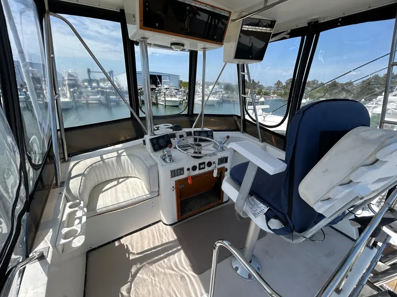 Slide: The Image of Interior view of 1990 Albemarle 325 Convertible boat cockpit with navigation equipment. - 18