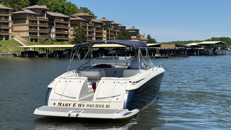 Slide: The Image of 2005 Regal 3350 Sport Cruiser on a lake near waterfront condos. - 15