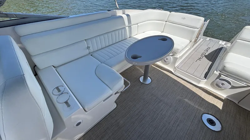 Slide: The Image of 2005 Regal 3350 Sport Cruiser interior with white seating and round table. - 20
