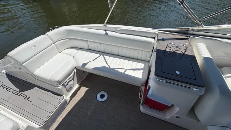 Slide: The Image of 2005 Regal 3350 Sport Cruiser interior with white seating and deck view. - 21