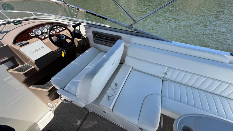 Slide: The Image of 2005 Regal 3350 Sport Cruiser interior with white seating and steering console. - 23