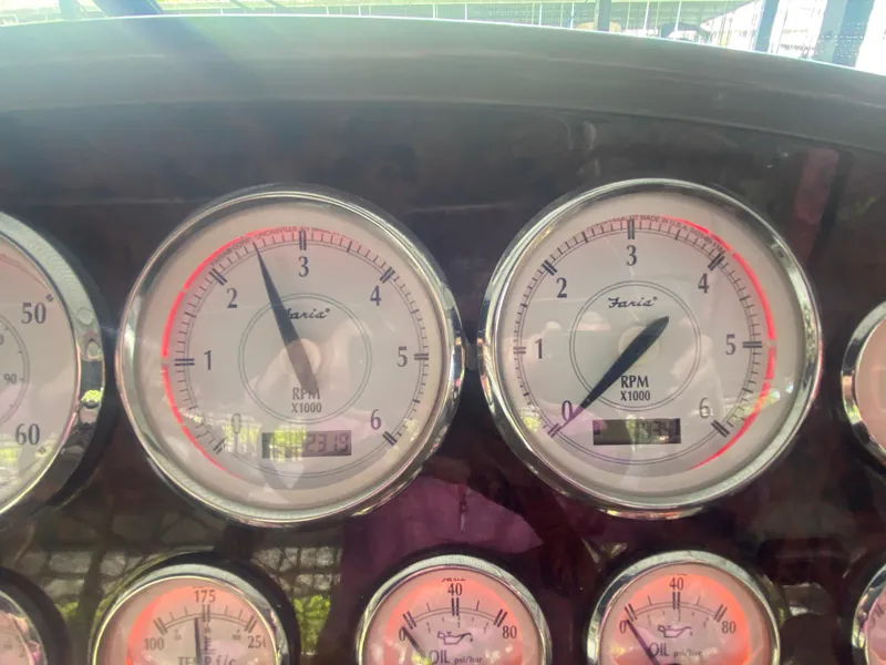 Slide: The Image of Dashboard gauges of a 2005 Regal 3350 Sport Cruiser boat. - 29