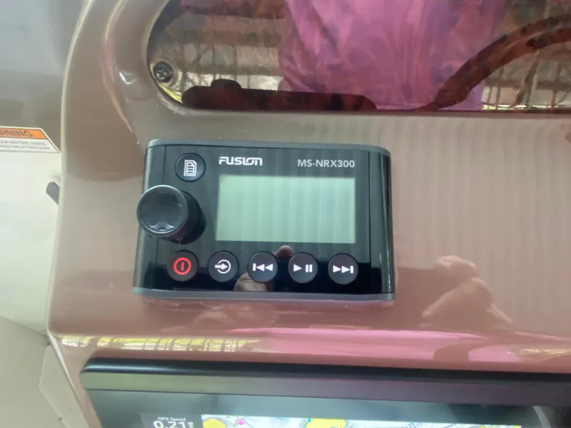 Slide: The Image of Fusion MS-NRX300 stereo system on 2005 Regal 3350 Sport Cruiser dashboard. - 32