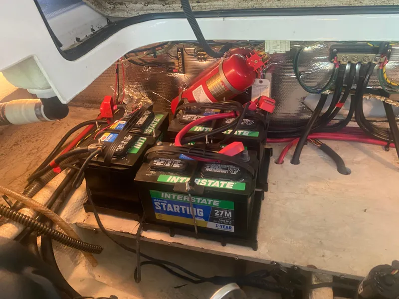 Slide: The Image of 2005 Regal 3350 Sport Cruiser engine compartment with batteries and fire extinguisher. - 36