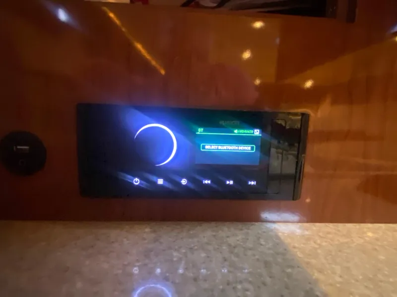 Slide: The Image of Control panel of a 2005 Regal 3350 Sport Cruiser with illuminated display. - 38