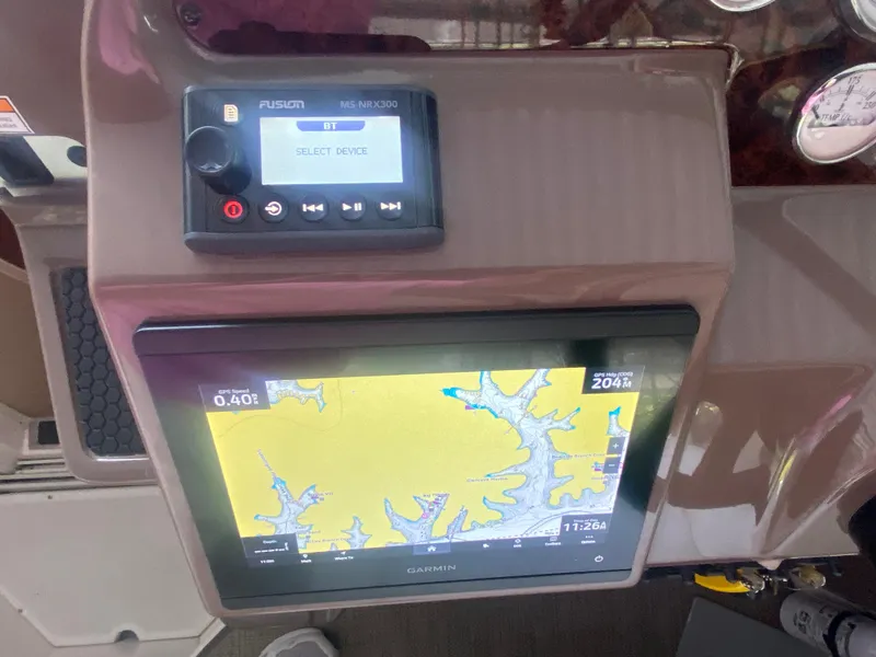 Slide: The Image of Control panel of a 2005 Regal 3350 Sport Cruiser with navigation display. - 39