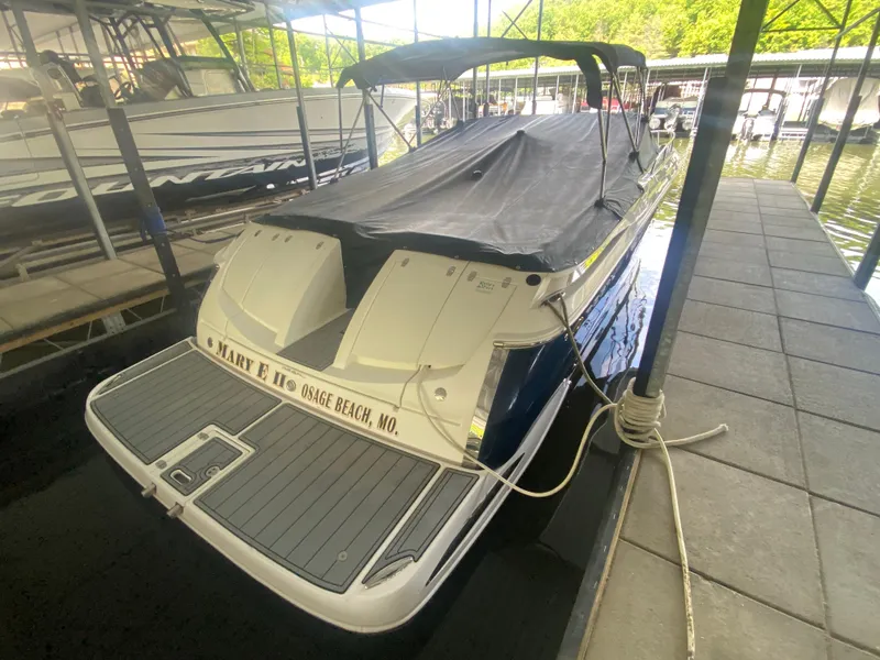 Slide: The Image of 2005 Regal 3350 Sport Cruiser docked at marina, covered and secured. - 48