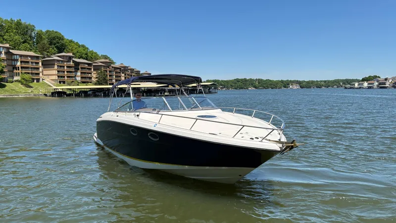 Slide: The Image of 2005 Regal 3350 Sport Cruiser on a lake with waterfront buildings in the background. - 6