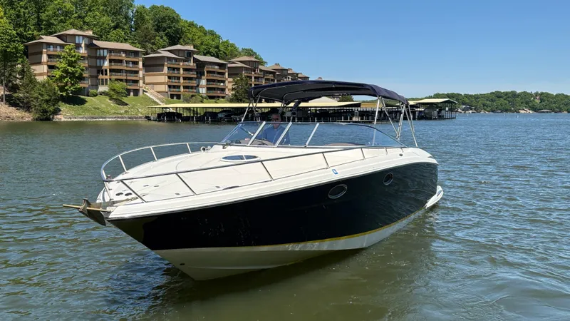 Slide: The Image of 2005 Regal 3350 Sport Cruiser on a lake near waterfront buildings. - 9