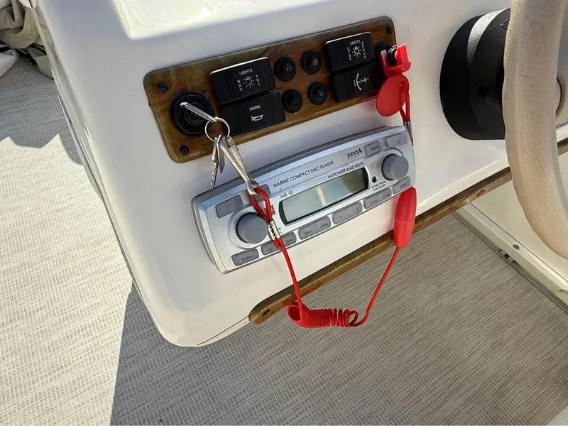 Slide: The Image of Control panel of a 2008 Bentley Pontoons 180 CRUISE with radio and ignition keys. - 10