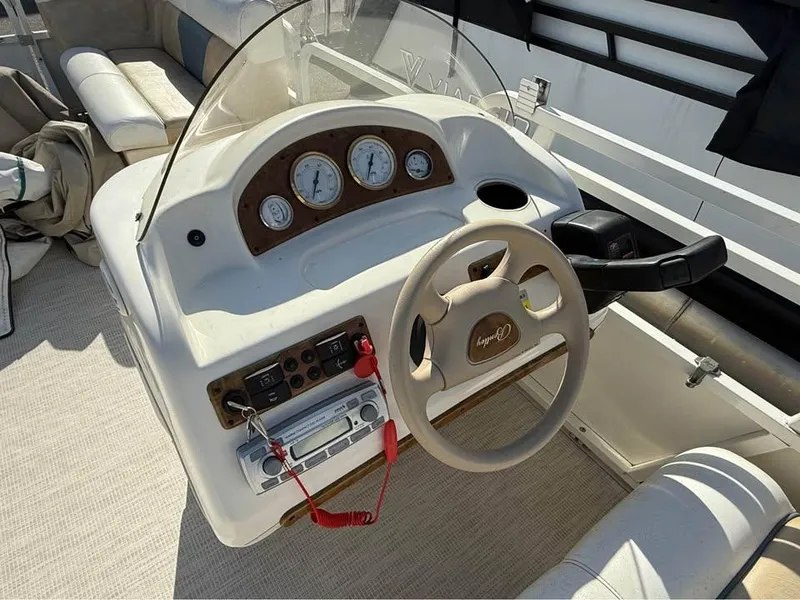 Slide: The Image of 2008 Bentley Pontoons 180 CRUISE dashboard with steering wheel and gauges. - 11