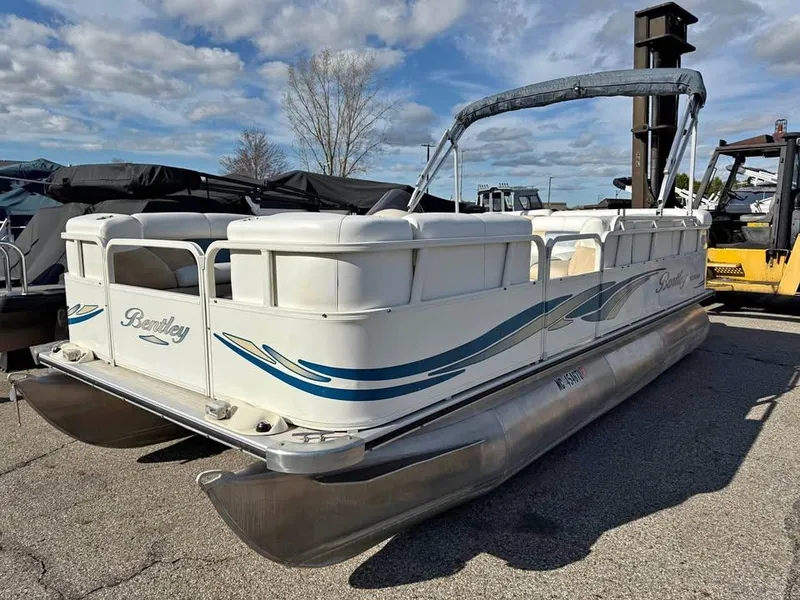 Slide: The Image of 2008 Bentley Pontoons 180 CRUISE pontoon boat on a sunny day, parked on pavement. - 3