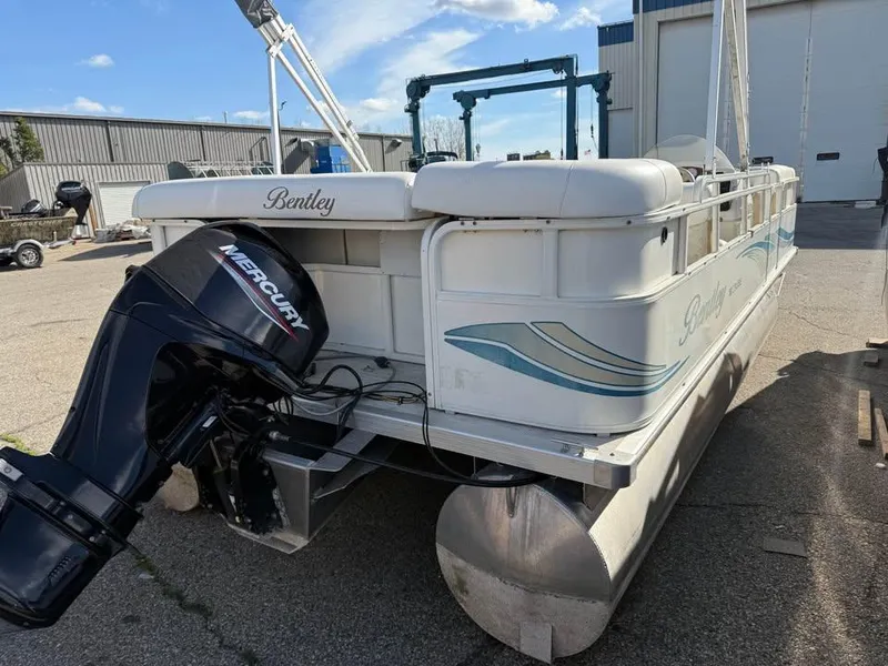 Slide: The Image of 2008 Bentley Pontoons 180 CRUISE with Mercury outboard motor, parked outdoors. - 5