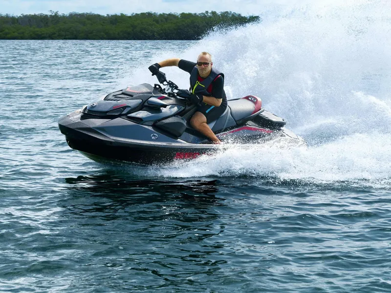 Slide: The Image of 2024 Sea-Doo GTR-X 300 iBR jet ski speeding on water, creating a splash. - 10