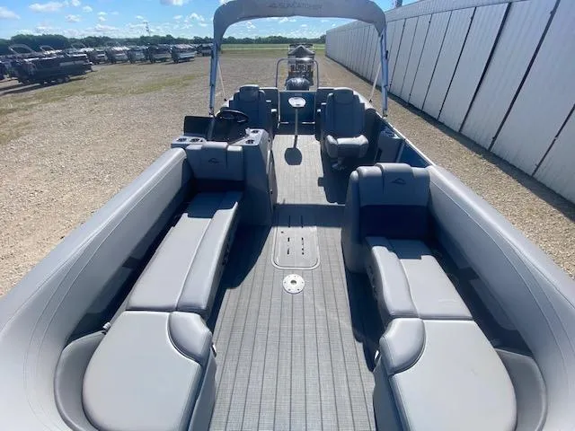 Slide: The Image of 2025 SunCatcher Fusion 322RC pontoon boat with spacious seating and modern design. - 1