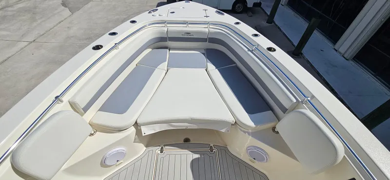Slide: The Image of 2019 Cobia 280 Center Console boat with spacious seating and sleek design. - 11