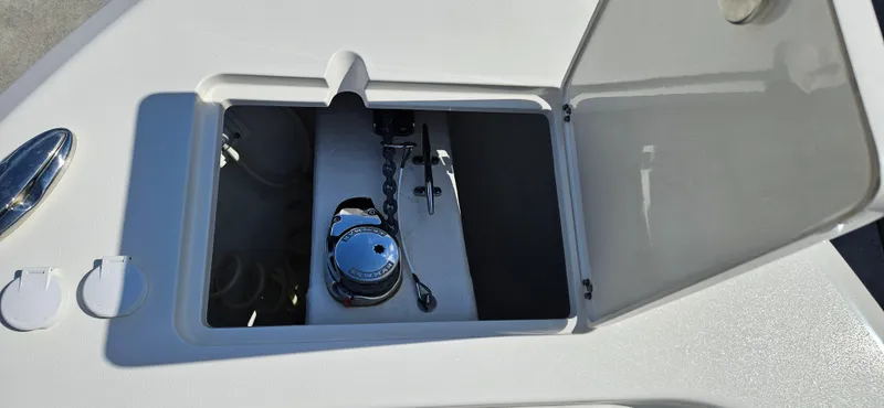 Slide: The Image of 2019 Cobia 280 Center Console anchor locker with open hatch. - 16