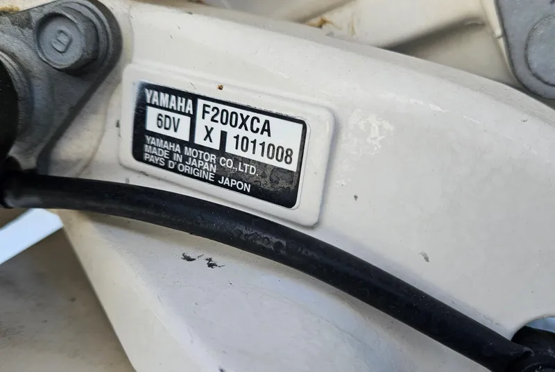 Slide: The Image of Yamaha F200XCA engine label on 2019 Cobia 280 Center Console boat. - 21