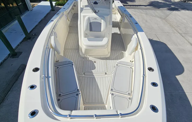 Slide: The Image of 2019 Cobia 280 Center Console boat interior with spacious seating and sleek design. - 3