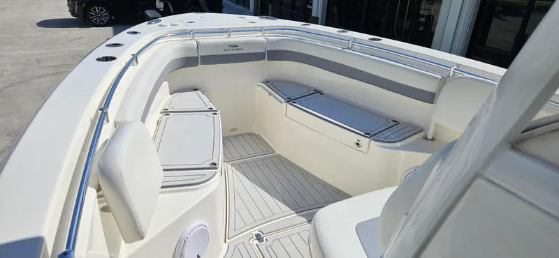 Slide: The Image of 2019 Cobia 280 Center Console boat interior with seating and storage compartments. - 6