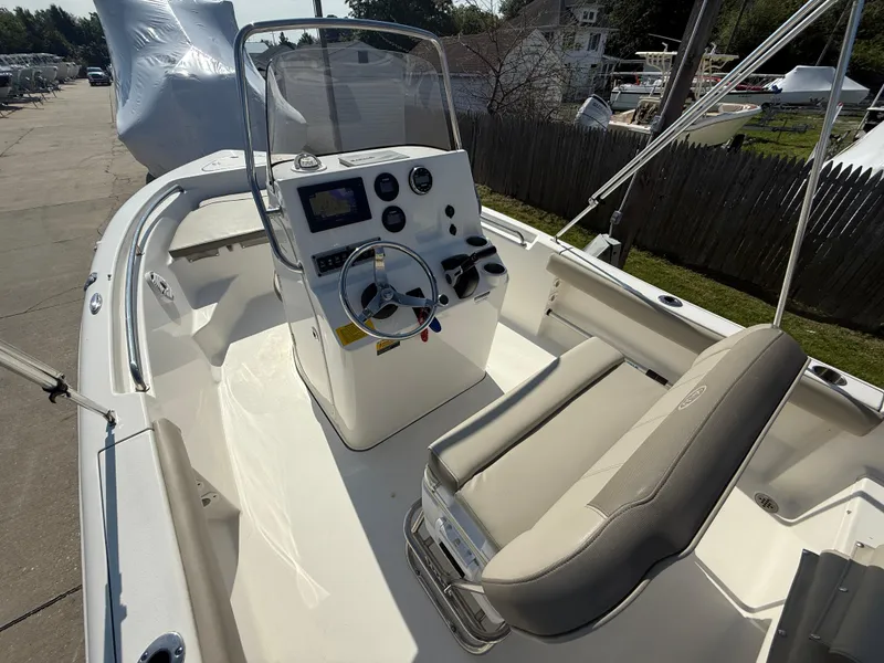 Slide: The Image of 2021 Key West 189 FS boat interior with steering console and seating. - 10