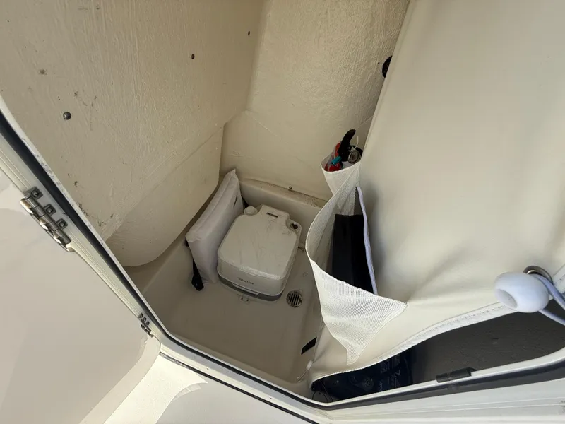 Slide: The Image of Interior of 2021 Key West 189 FS boat with compact marine toilet. - 15