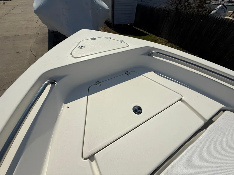 Slide: The Image of 2021 Key West 189 FS boat deck with storage compartment and railings. - 17