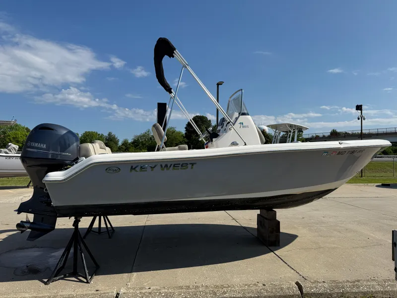 Slide: The Image of 2021 Key West 189 FS boat on display, featuring Yamaha engine, clear sky background. - 4