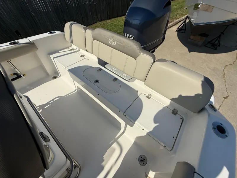 Slide: The Image of 2021 Key West 189 FS boat interior with seating and storage compartments. - 8