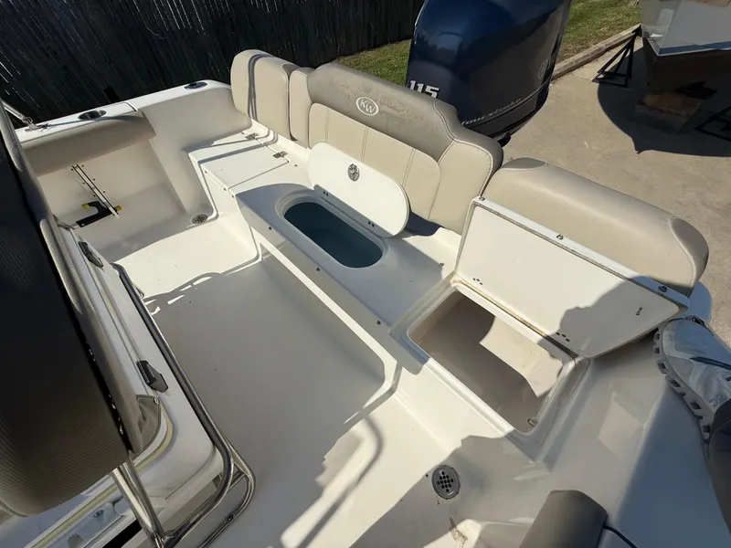 Slide: The Image of 2021 Key West 189 FS boat interior with seating and storage compartments. - 9