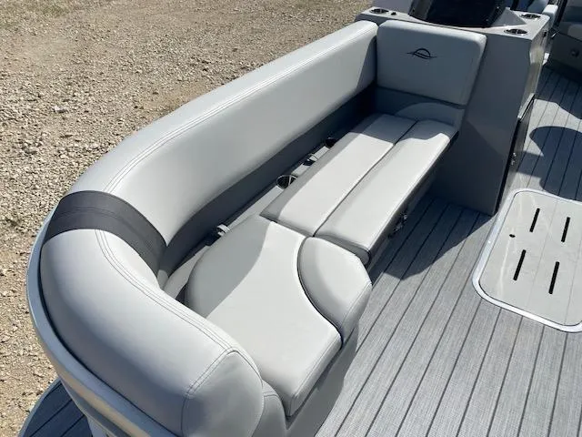 Slide: The Image of 2025 SunCatcher Select 322RF boat interior with gray seating and flooring. - 10