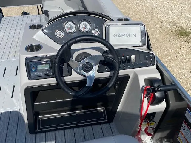 Slide: The Image of Steering console of 2025 SunCatcher Select 322RF with Garmin navigation system. - 11