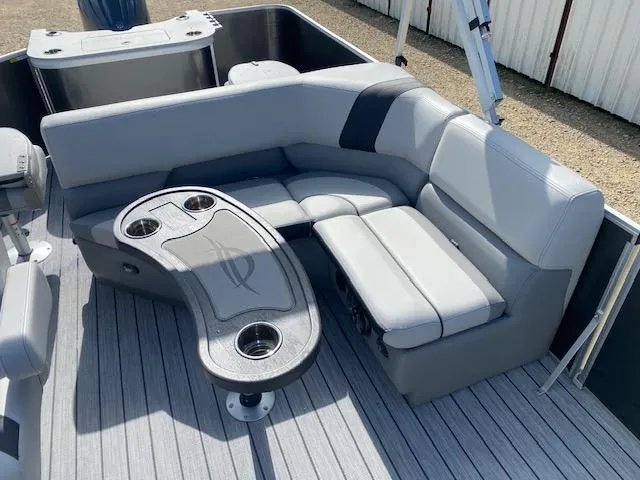 Slide: The Image of Luxurious seating area on 2025 SunCatcher Select 322RF pontoon boat with cup holders. - 13