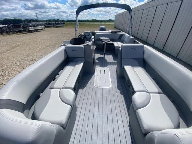 Slide: The Image of 2025 SunCatcher Select 322RF pontoon boat with spacious seating and modern design. - 8