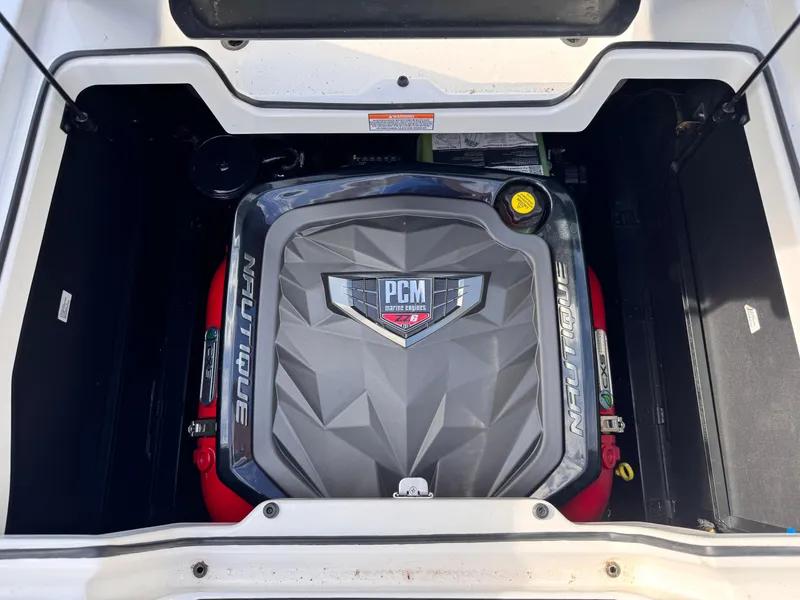 Slide: The Image of Engine compartment of 2022 Nautique Super Air Nautique G21 boat, featuring PCM engine. - 11