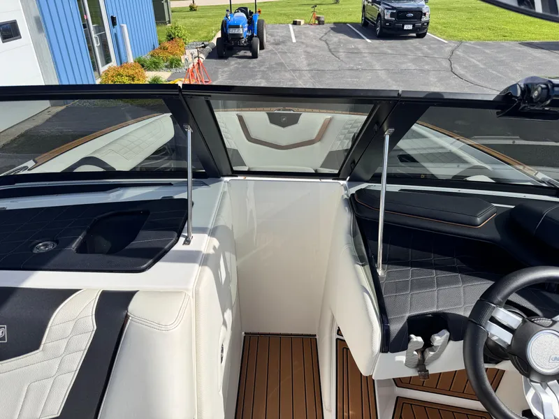 Slide: The Image of 2022 Nautique Super Air Nautique G21 interior with sleek design and modern dashboard. - 14