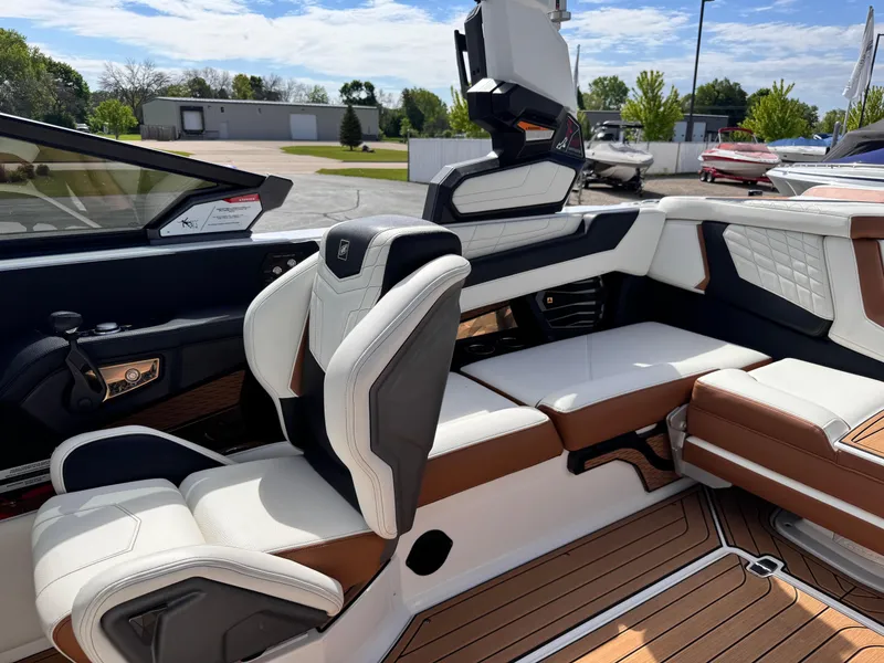 Slide: The Image of Interior of 2022 Nautique Super Air Nautique G21 boat with luxurious seating and modern design. - 18