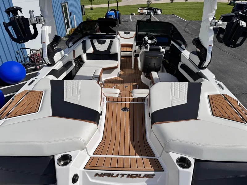 Slide: The Image of 2022 Nautique Super Air Nautique G21 interior with luxurious seating and modern design. - 23