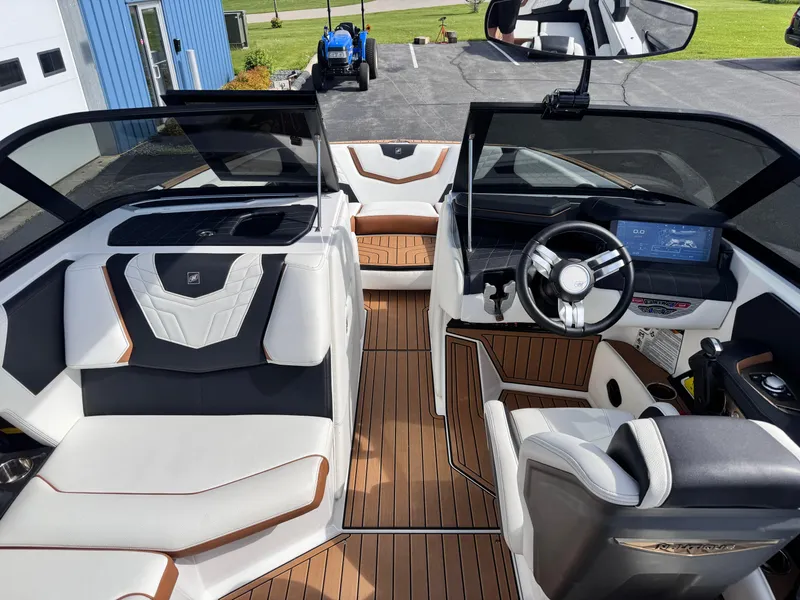 Slide: The Image of 2022 Nautique Super Air Nautique G21 interior with modern dashboard and seating. - 26