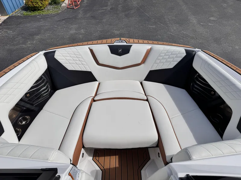 Slide: The Image of Luxurious interior of 2022 Nautique Super Air Nautique G21 boat with white seating. - 5