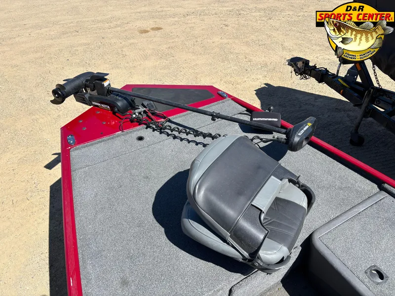 Slide: The Image of 2021 Tracker Bass Tracker Classic XL boat with trolling motor and seat, displayed outdoors. - 4