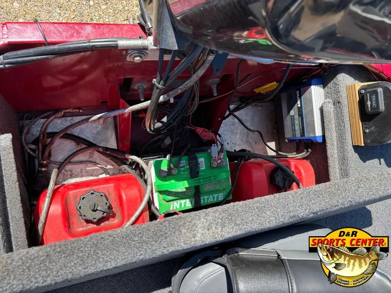 Slide: The Image of 2021 Tracker Bass Tracker Classic XL boat battery compartment with wiring and fuel tanks. - 5