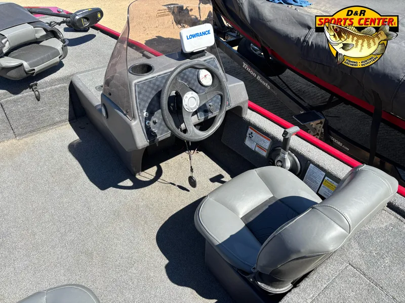 Slide: The Image of 2021 Tracker Bass Tracker Classic XL boat interior with steering wheel and seating. - 7
