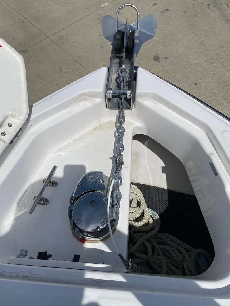 Slide: The Image of Anchor compartment of 2017 Chaparral 307 SSX boat with chain and rope. - 11